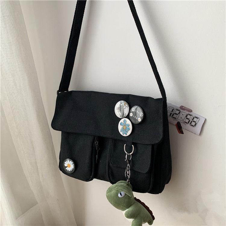 Bolsa Feminina Transversal Basic Flower + Brinde Fofo BS-FM02 LojasStonks Margaridas Preto + Dinossauro 